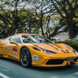 panning photography of Ferrari 458 on road